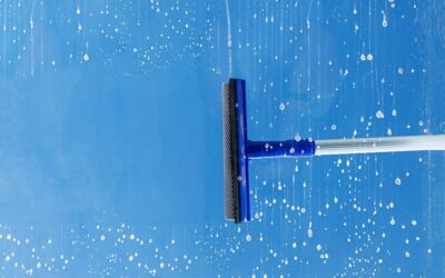 rubber-squeegee-cleans-window-clears-stripe-soaped-window-cleaning-service-concept